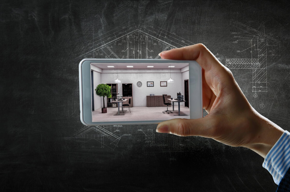 Hand holding a smartphone displaying a virtual tour of a sustainable real estate interior, illustrating the immersive visual experience.